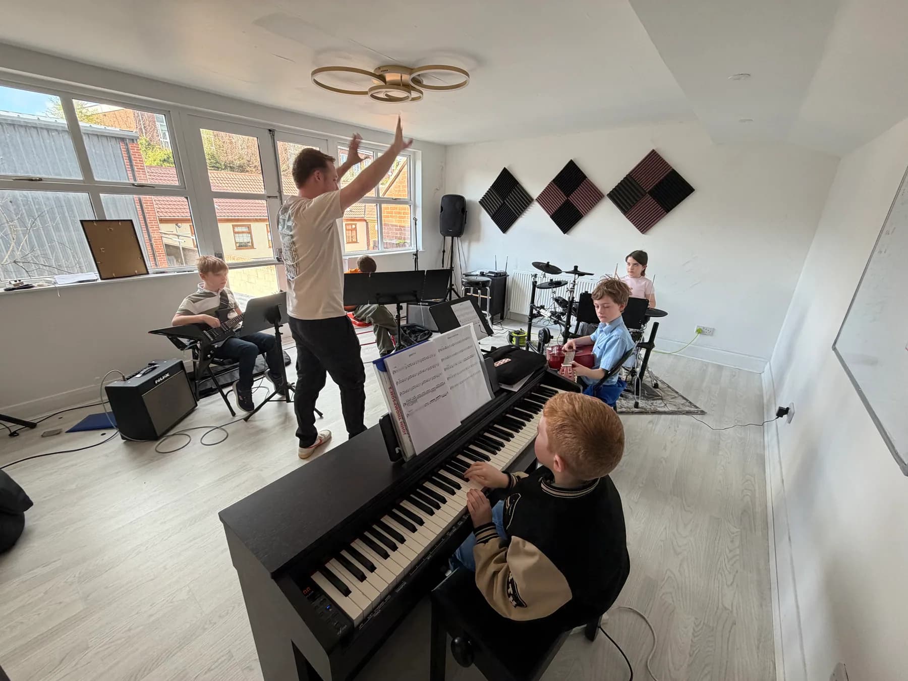 Young musicians playing together in an Apollo band